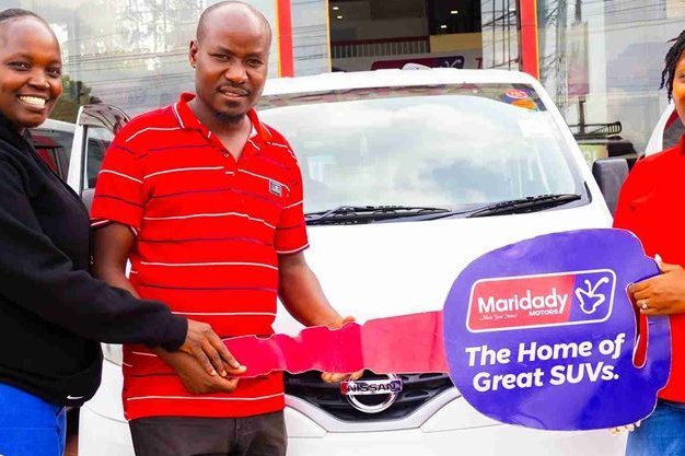 Mr and Mrs Jotham receiving their car key