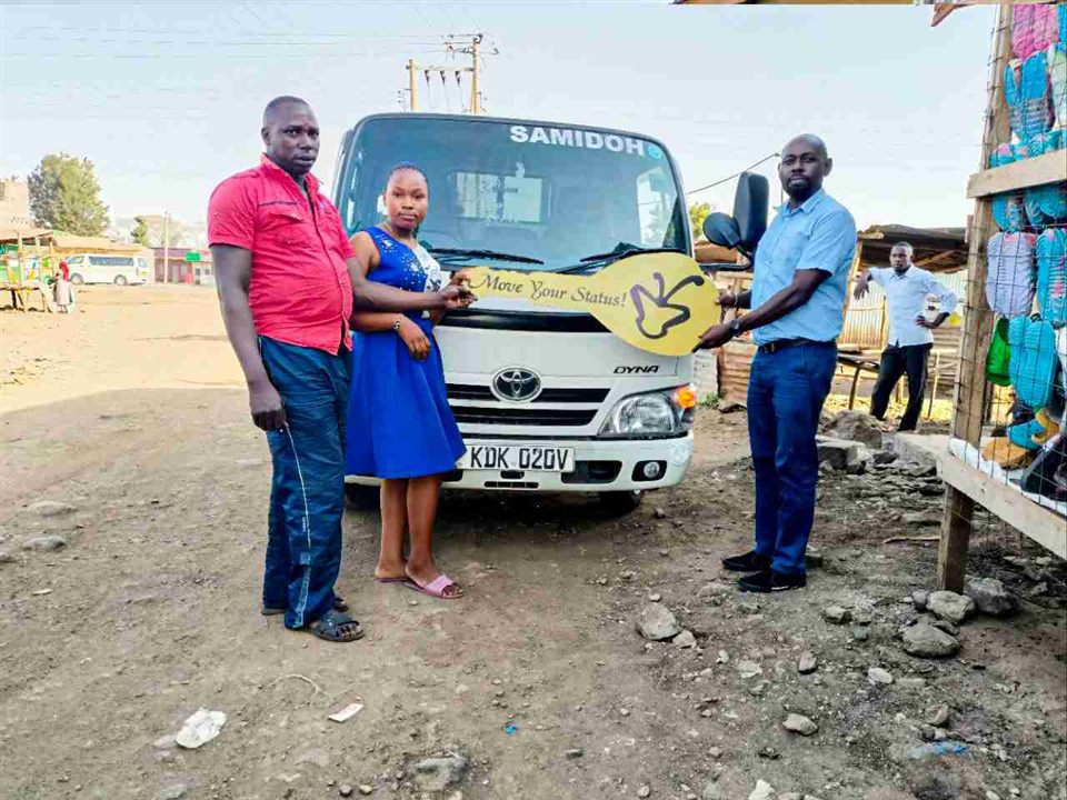 Samuel Gitau receiving his Toyota Dyna in Mwea